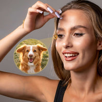 Thumbnail for Hearts Photo Necklace by Brother & Sisters featuring a woman with a heart-shaped locket showing a dog's photo.