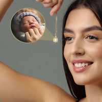 Thumbnail for Woman showcasing a Square Photo Necklace by Brother & Sisters, featuring a cherished photo of a baby.