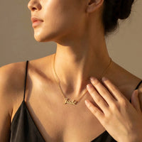 Thumbnail for Minimalist Name Necklace in gold with the name Jade, worn in three-quarter profile | SKU: minimalistnn-gold