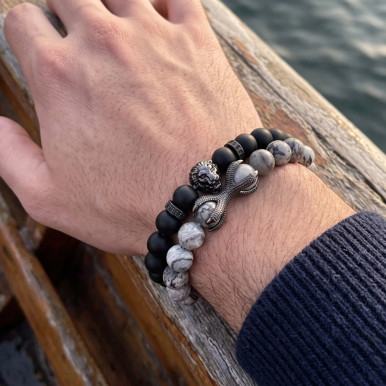 Black Lion with Black & Grey Stones Set – close-up worn on a man's wrist | Brother & Sisters | SKU: 21369621-gun-black-XS-14-15, 21369621-gun-black-S-16-17, 21369621-gun-black-M-18-19, 21369621-gun-black-L-20-21, 21369621-gun-black-XL-22-23