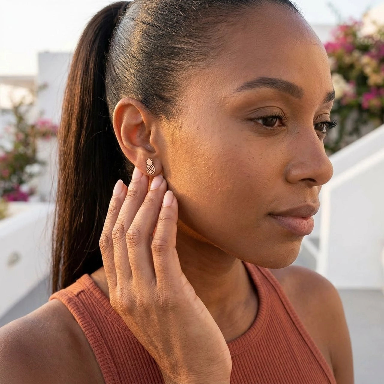 Stainless steel stud earrings — worn, everyday gesture, rose gold | SKU: 437186-rose-gold-color