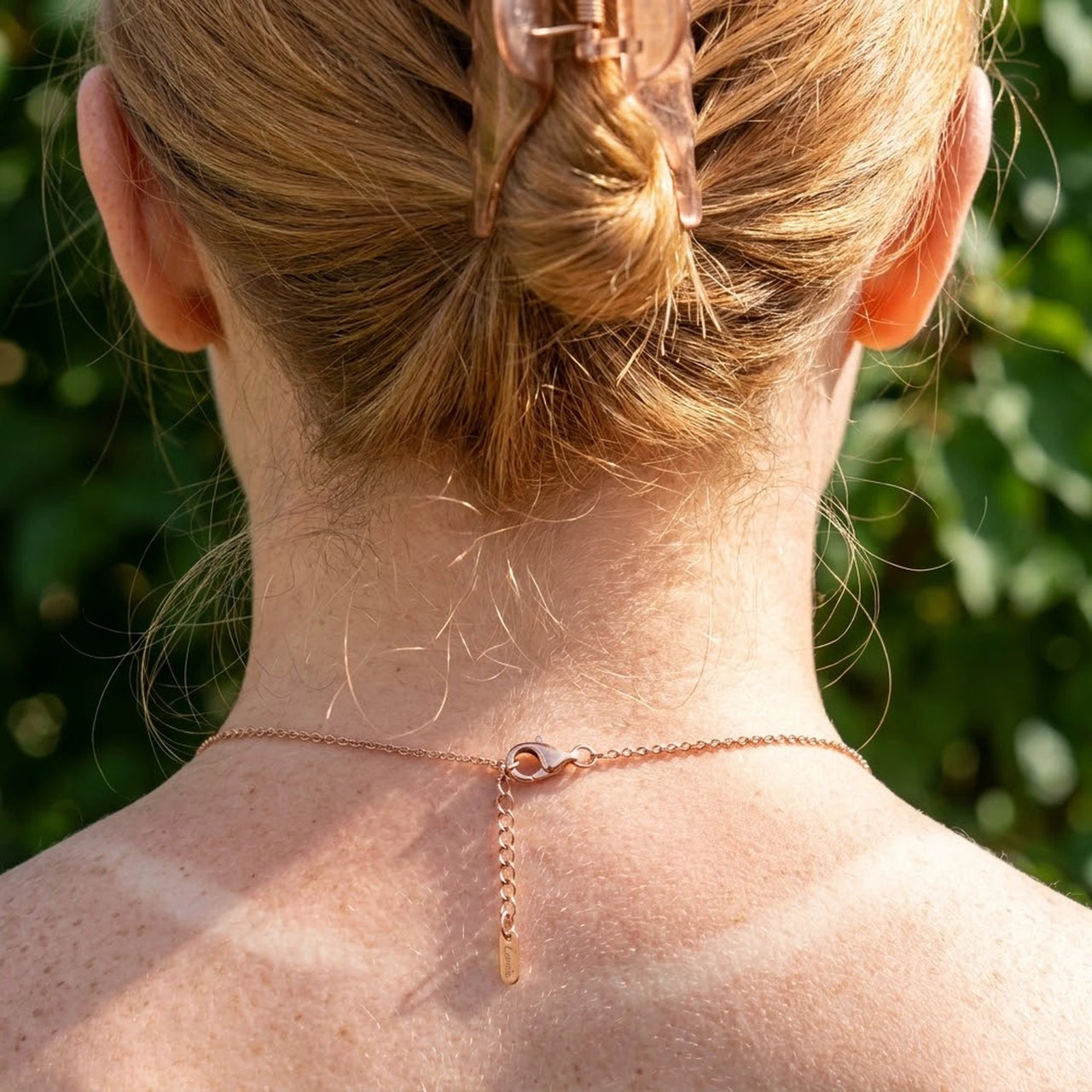 Minimalist Name Necklace in rose gold lobster clasp and adjustable extension chain seen at the nape | SKU: minimalistnn-rosegold