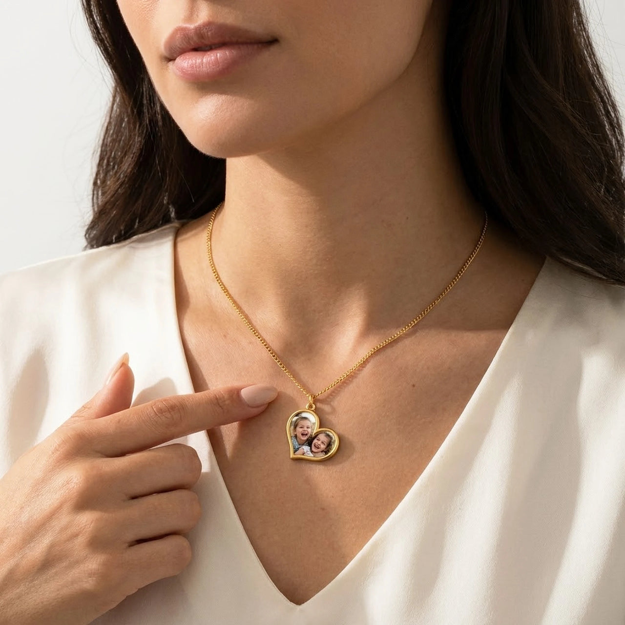 Woman touching the gold secret heart photo necklace, the hidden photo of her children appears | SKU: TPH-HRTN-GOLD