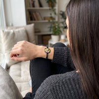 Thumbnail for Woman looking at her grandmother's photo in the black octagon photo bracelet | SKU: TPH-OCTB-BLACK-18