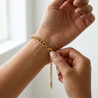Thumbnail for The gold round photo bracelet on the wrist, showing the lobster clasp and extension chain | SKU: TPH-RNDB-GOLD