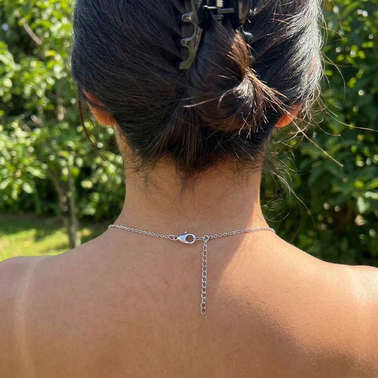 Minimalist Name Necklace in silver lobster clasp and adjustable extension chain seen at the nape | SKU: minimalistnn-silver